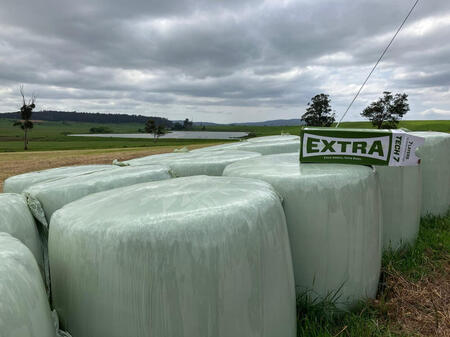 A stack of Silage Wrap, Silage Film, and Net Wrap, essential for protecting hay bales and silage from UV degradation and weather damage.